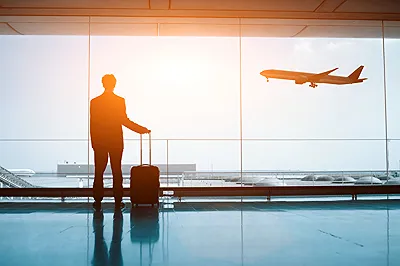 Man with luggage at airport